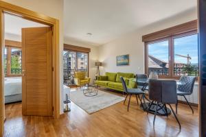 a living room with a green couch and chairs at Vila Elsa 2 in Zlatibor