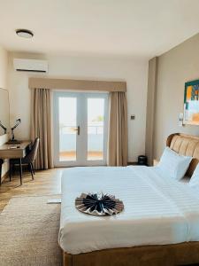 Postel nebo postele na pokoji v ubytování Hotel Midotel Seaview