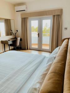 Postel nebo postele na pokoji v ubytování Hotel Midotel Seaview
