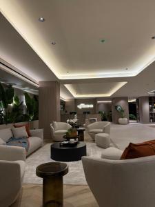 a large living room with couches and tables in a building at La Résidence Panamá in Panama City +240 photos