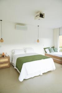 Katil atau katil-katil dalam bilik di Paraíso dos Ipês +30 gambar