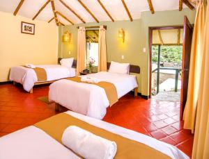 Rúm í herbergi á Hotel Kuntur Wassi
