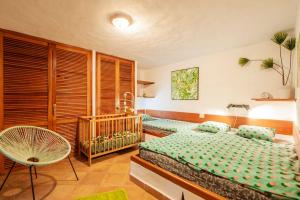 En eller flere senge i et værelse på Casa Papaya 1, La Palma