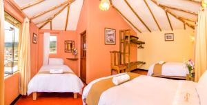 Un pat sau paturi într-o cameră la Hotel Kuntur Wassi
