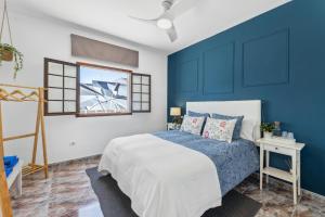 Postel nebo postele na pokoji v ubytování Habitaciones privadas cerca de la playa y aeropuerto en casa compartida con otros huéspedes + 19 fotografií