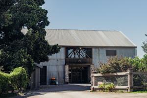a large metal building with a gate in front of it at VintageSteel Hinton 