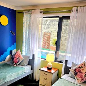 Ένα ή περισσότερα κρεβάτια σε δωμάτιο στο Joyful Living Guest House +37 φωτογραφίες