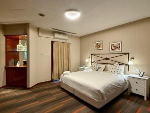 Postel nebo postele na pokoji v ubytování Alocassia Serviced Apartments + 33 fotografií