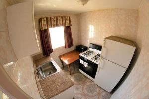 an overhead view of a kitchen with a refrigerator at The Palace Inn in Oxnard