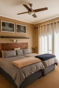 Ένα ή περισσότερα κρεβάτια σε δωμάτιο στο Lagoon Step Self catering Unit