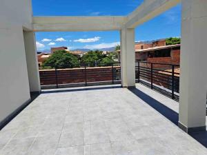 an empty balcony with a view of the city at Beautiful house downtown in Tarija