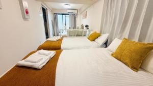 Postel nebo postele na pokoji v ubytování R Inn 本町 R-Inn Hommachi