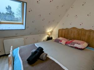 a bedroom with a large bed in a room at Gîte paisible près de l'Indre, proche de la nature, 2 chambres - FR-1-591-750 in Buzançais