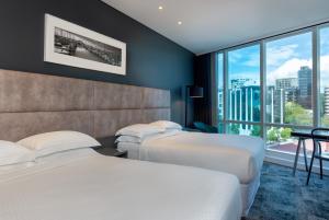 Posteľ alebo postele v izbe v ubytovaní Four Points by Sheraton Auckland