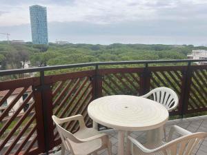 a white table and chairs on a balcony at Studio in Lido di Jesolo 54508 in Lido di Jesolo
