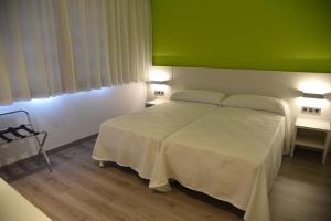 Postel nebo postele na pokoji v ubytování Hotel Julimar