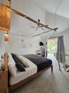 Postel nebo postele na pokoji v ubytování Casa Shambala B&B