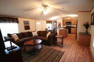 a living room with a couch and a table at Eagle Ford Village Suites in Dilley