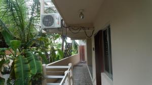 a balcony of a house with a air conditioner at Casa Laani in Puerto Escondido