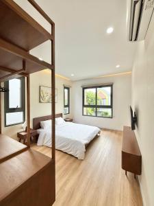 Postel nebo postele na pokoji v ubytování Casa Passion Villa Hồ Tràm