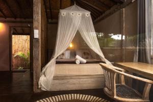 Voodi või voodid majutusasutuse Lost Paradise Gili toas