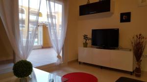TV a/nebo společenská místnost v ubytování Apartamento Cotillo Playa
