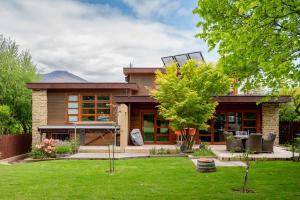 a home with a yard with a house at Macpherson Street, Wanaka in Wanaka