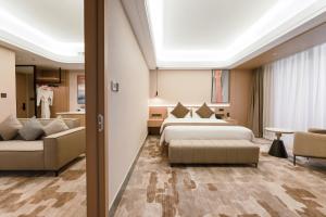 Letto o letti in una camera di JD POLMAN Hotel