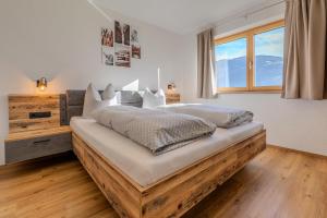 Postel nebo postele na pokoji v ubytování Appart Zellblick