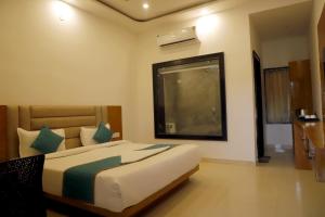 Postel nebo postele na pokoji v ubytování Kesariya Bagh Resort Pushkar