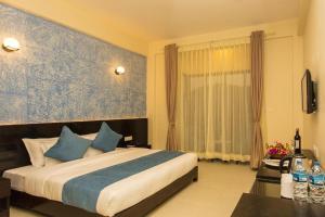 Krevet ili kreveti u jedinici u okviru objekta Tuki Resort Pokhara