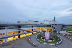 a building with a fountain in front of it at Rumanza by Pearl Continental in Multan