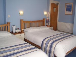Llit o llits en una habitació de Copper Beech Rooms