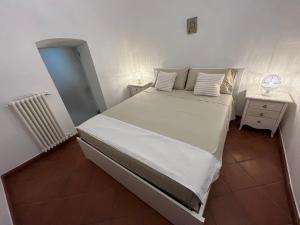 a bedroom with a large bed in a room at Trulli Capomazza in Noci +19 photos