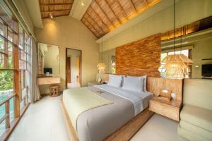 Postel nebo postele na pokoji v ubytování Manca Villa Canggu by Ini Vie Hospitality
