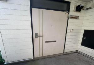 a door in the side of a building at RHK Guest House102 in Tokyo