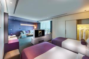 Letto o letti in una camera di The Act Hotel Sharjah
