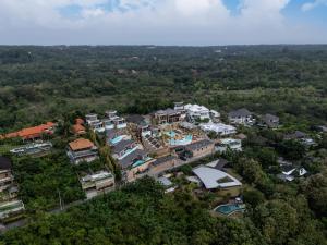 an aerial view of a house in the forest at Seascape Resort & Spa Uluwatu by Ini Vie Hospitality in Uluwatu
