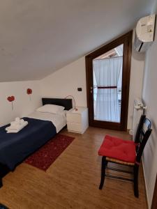 Ένα ή περισσότερα κρεβάτια σε δωμάτιο στο B&B La Terrazza di Frascati