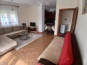 a living room with a couch and a table at ED Living in Orikum