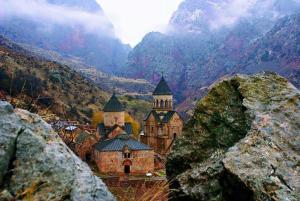 an old building with two towers on a mountain at Noravank B&B in Chʼiva