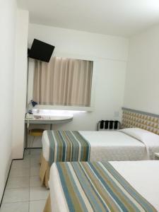 Postel nebo postele na pokoji v ubytování Ibis Budget Salvador
