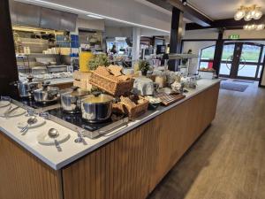 a kitchen with a counter with pots and pans at Rasta Lilla Edet in Lilla Edet