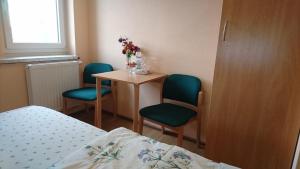 Postel nebo postele na pokoji v ubytování Heidebistro