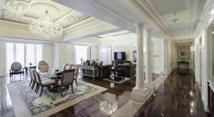 a large living room with a table and a dining room at Dragon Lake Princess Hotel in Huadu