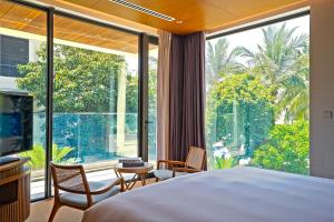 TV a/nebo společenská místnost v ubytování The Five Villas & Resort Quangnam - Danang