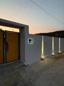 a building with a door with lights on it at Katikia in Línia