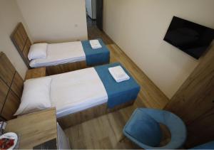 Letto o letti in una camera di ANGINE Resort Hotel