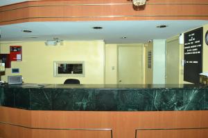 a large black counter in a hospital lobby at Travel Inn New Castle Airport in New Castle