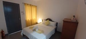 Postel nebo postele na pokoji v ubytování Sebastian Guest House